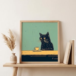 May include: A framed art print featuring a black cat with yellow eyes, sitting at a table with a yellow teacup and saucer. The background is a light green color, and the table is yellow and navy blue.
