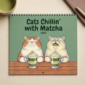 May include: A 2027 wall calendar with a sage green cover featuring the text "Cats Chillin' with Matcha". The illustration shows two cats sitting at a wooden table, each with a glass mug of green matcha latte topped with whipped cream.