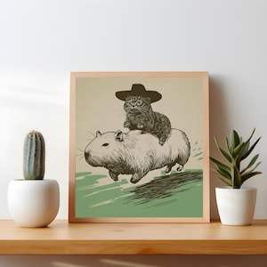 Grappige cowboy kat & capibara poster - eigenzinnig retro interieur - Silly Animal Art Print - cadeau voor kattenliefhebbers