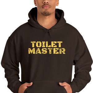 May include: A brown hooded sweatshirt with the text "TOILET MASTER" printed in yellow on the front.