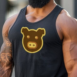 May include: A man with a full beard is wearing a black tank top with a brown pig face graphic. The pig face is outlined in yellow.