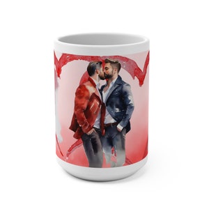 May include: White ceramic mug with a watercolor illustration of two men kissing. The background is pink with red hearts.