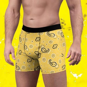 May include: Yellow boxer shorts with a black paisley pattern.