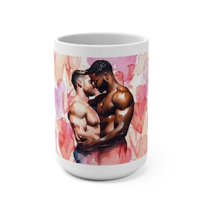 May include: White ceramic mug with a watercolor illustration of two men embracing. The men are shirtless and have different skin tones. The background is a pink and white watercolor pattern of hearts.