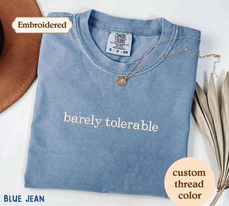 a blue t - shirt with the words barrelly tolerable on it