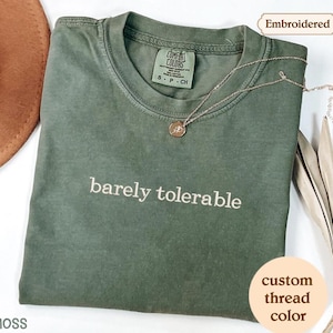 a green t - shirt with the words barley tolerable on it