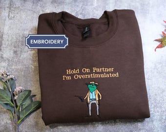 Hold On Partner Im Overstimulated Shirt Cowboy Frog Embroidered Unhinged Weirdcore Clothing Gen Z Shirt Weird Stuff Funny Funny Meme Shirt