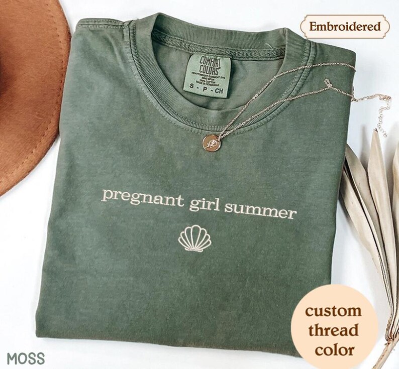 a green t - shirt with the words pregnant girl summer on it