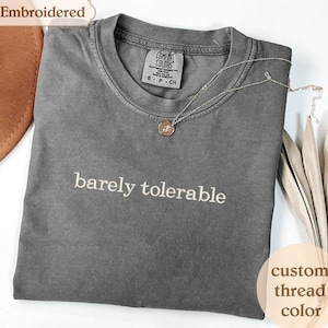 a t - shirt with the words barely tolerable on it