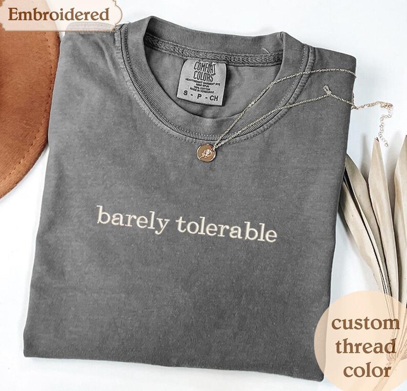 a t - shirt with the words barely tolerable on it