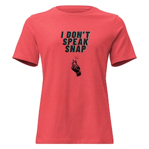 May include: Red t-shirt with the text "I DON'T SPEAK SNAP" in black and blue, and a black hand gesture graphic. The shirt is a solid red color and has short sleeves.