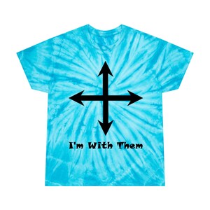 May include: A turquoise tie-dye t-shirt featuring a black cross with arrows pointing in four directions. The text "I'm With Them" is printed below the cross in black.