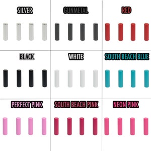 Puede incluir: Un conjunto de 10 tubos metálicos cilíndricos en varios colores, incluyendo plata, gris oscuro, rojo, negro, blanco, azul, rosa y rosa neón. Los tubos están dispuestos en filas de cinco, con cada fila representando un color diferente.