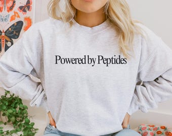 Powered by Peptides Crewneck | Wellness Consultant Gift Sweatshirt | Gildan Pullover | Funny Wellness Coach Top | Health & Fitness Gift