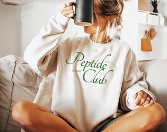 Sweat-shirt ras du cou Wellness Peptide Club, Sweat-shirt pour consultant en fabrication, Sweat-shirt pour revendeur Peptide, fabrication de chemise peptide, fabrication de vêtements, fabrication