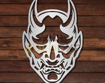 May include: A silver metal wall decor in the shape of a Japanese demon mask with horns and a fierce expression.