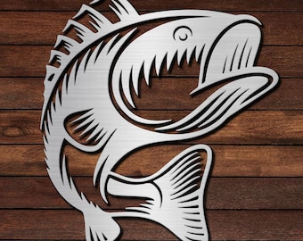 May include: A silver metal cutout of a fish with its mouth open, set against a woodgrain background.