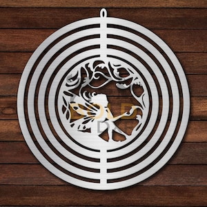 May include: A metal wind chime with a circular design featuring a fairy with wings and floral details. The chime has multiple concentric circles and a hanging loop at the top.