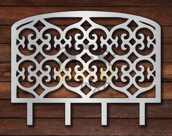 May include: A silver metal decorative fence with a decorative design of swirls and loops. The fence has three legs.