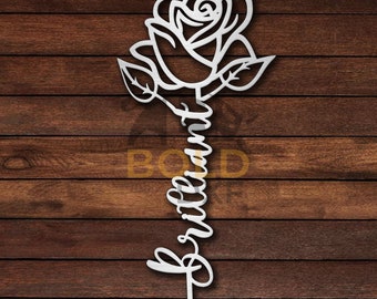 May include: White metal rose with the word "brilliant" written in a cursive font along the stem.