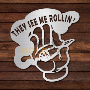 May include: Metal wall art featuring a hand holding a joint with the text "THEY SEE ME ROLLIN'" above it.