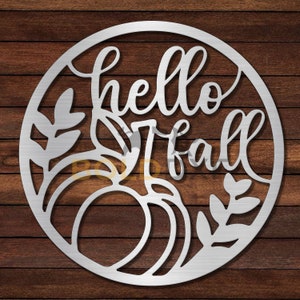 May include: A metal circle with a cutout design of pumpkins and leaves. The text "hello fall" is written in a decorative font.