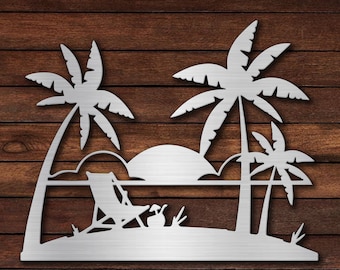 May include: A metal wall art silhouette of a beach scene with palm trees, a beach chair, and a sunset. The silhouette is cut out of a silver metal sheet.