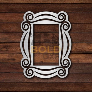 May include: A silver metal frame with a decorative design reminiscent of the iconic "Friends" TV show logo. The frame is perfect for displaying photos or artwork.