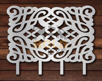 May include: A silver metal cake topper with a square design featuring intricate cutouts of swirls and diamonds. The topper has three prongs for inserting into a cake.