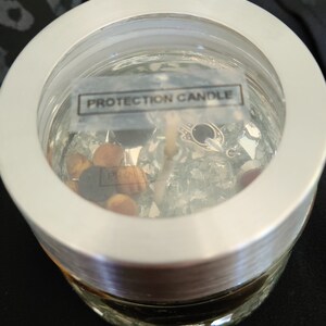 Powerful Protection Candle with Gemstones | Charms and Obsidian,Hamsa,Lava Rock,Dragons Bloodstone  | Fragrance  | Essential Oil
