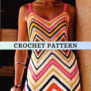 May include: A crochet dress with a chevron pattern in pink, yellow, white, and blue.