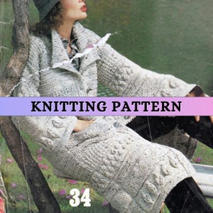 May include: A light gray knitted coat with a textured pattern, featuring a shawl collar and button closure. The image includes the text "KNITTING PATTERN" and the number "34". The coat is worn by a person wearing a hat.