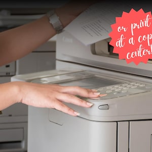 Hands operating a professional copy center printer machine, print your wedding word search puzzle at a copy center for best results