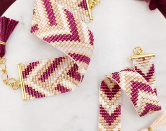 May include: Two loom bracelets featuring a chevron pattern in magenta, cream, and gold beads. Each bracelet has gold-tone metal end bars, a chain extender, and a tassel. Text includes SET OF LOOM BRACELET PATTERNS, FREYA & DALIA, and Miyuki Delica 11/0 Beads Chart.