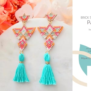 May include: A pair of beaded brick stitch earrings with a geometric design in pink, orange, and white. The earrings have turquoise tassels and are displayed on a white surface. The image also includes text that says "BRICK STITCH EARRINGS PATTERN".