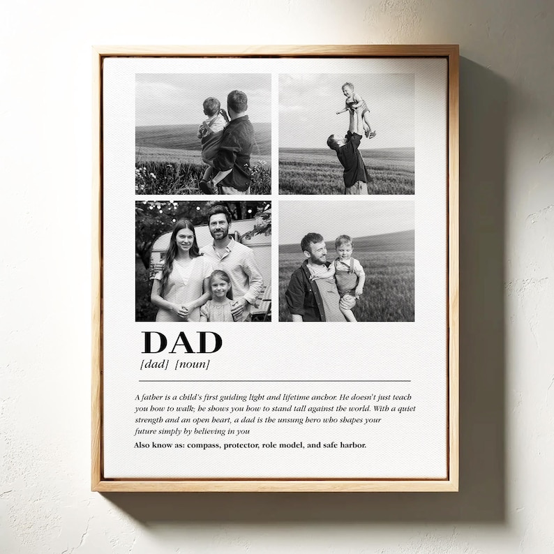 May include: A framed black and white photo collage featuring four family photos. The word "DAD" is printed below the photos, along with a definition. The frame is made of light-colored wood.