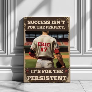 May include: A canvas print featuring a baseball player in a cream-colored jersey with the name "Eric" and the number "7". The text on the print reads "SUCCESS ISN'T FOR THE PERFECT, IT'S FOR THE PERSISTENT" in a distressed font, with a baseball field background.