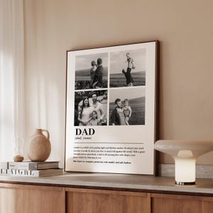 May include: A framed black and white print featuring four family photos. The word "DAD" is centered below the photos, with a definition below. The print includes a quote about fathers. The frame is a warm brown color.