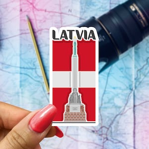 May include: A sticker with the word "LATVIA" in white letters on a red background. The sticker features a white and red Latvian flag with a stylized illustration of the Freedom Monument in Riga, Latvia.