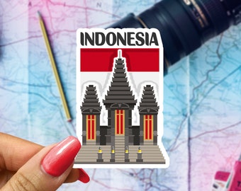 May include: A sticker featuring a stylized illustration of a traditional Indonesian temple with a red and white flag above it. The text "INDONESIA" is printed in black at the top of the sticker.