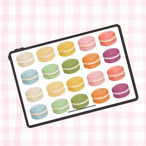 Könnte beinhalten: Digitale Illustration eines Tablets mit einer Vielzahl bunter Macarons. Die Macarons sind in Gelb-, Grün-, Orange-, Rosa-, Lila- und Blautönen gehalten. Der Hintergrund ist ein rosa-weißes Karomuster.