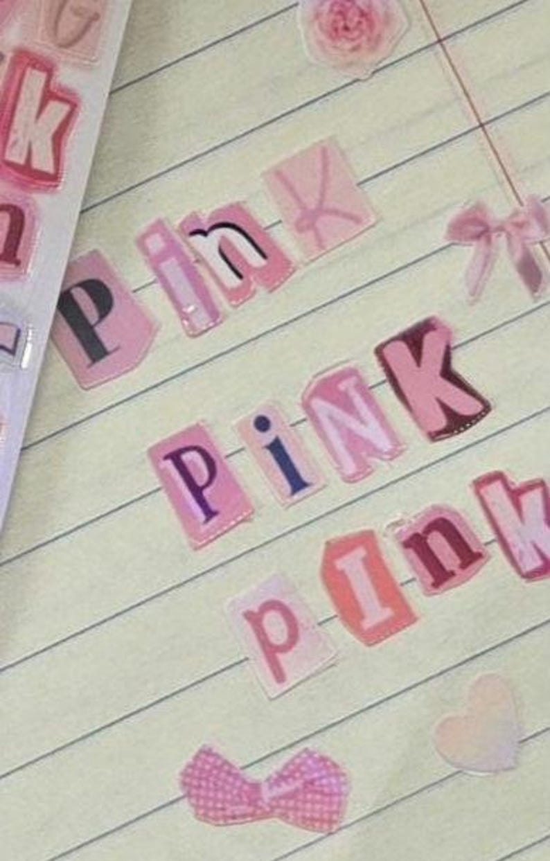 May include: Pink paper letters spelling out the word 'pink' on a lined notebook page. The letters are cut out and pasted on the page. There is a pink flower, a pink bow, and a pink heart sticker on the page.Magazine alphabet sticker Cutout letter scrapbook journal sticker cute sticker Trinket letter sticker fun alphabet sticker newspaper sticker funky letter sticker Junk Journal girlie Y2K retro sticker bullet