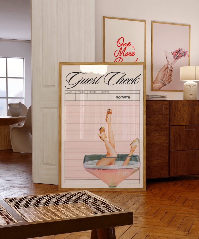 May include: A pink and white guest check with a retro illustration of a woman's legs in a champagne glass. The text "Guest Check" is written in black cursive font.