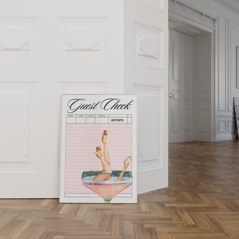 May include: A pink and white guest check with a black and white illustration of a woman's legs in a champagne glass. The text "Guest Check" is at the top of the check.