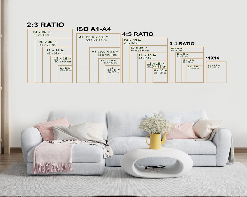 May include: A white wall with a white couch and a white oval coffee table. The wall has a chart with different aspect ratios and their corresponding measurements in inches and centimeters. The chart is labeled with the following titles: 2:3 Ratio, ISO A1-A4, 4:5 Ratio, 3:4 Ratio, and 11x14.