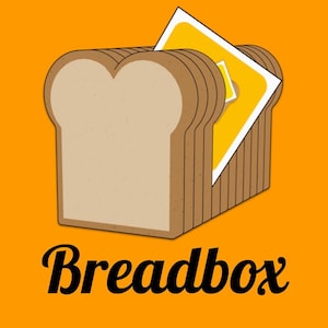 May include: A cartoon illustration of a breadbox made of bread slices, with a yellow square inside. The word "Breadbox" is written in a cursive font below the breadbox, all set against an orange background.