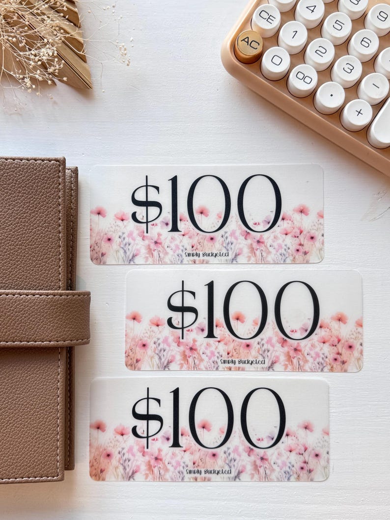 May include: Three gift cards with a floral design and the text "$100" and "Simply Budgeted".