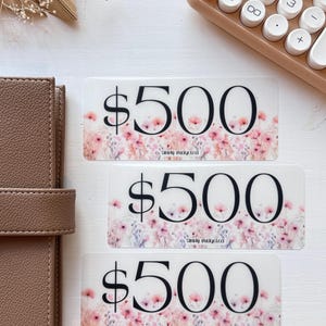 May include: Three gift cards with a floral design and the text "$500" and "Simply Budgeted".