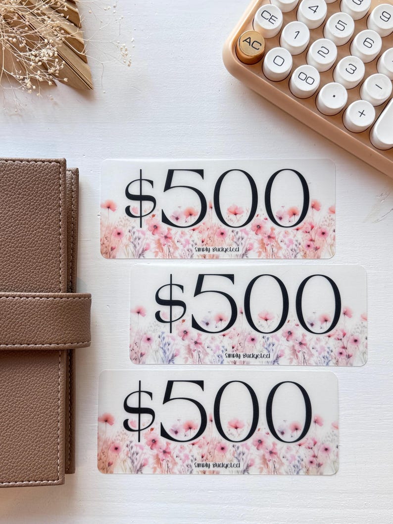 May include: Three gift cards with a floral design and the text "$500" and "Simply Budgeted".