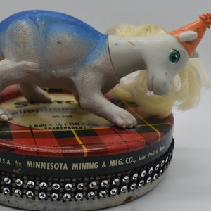 Doll Assemblage &quot;Magical&quot; Mashup Dinosaur Wizard Figures on Metal Tape Container Decorated with Rhinestones